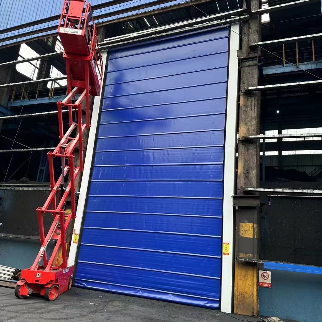 Blue industrial stacking door installed on a factory building