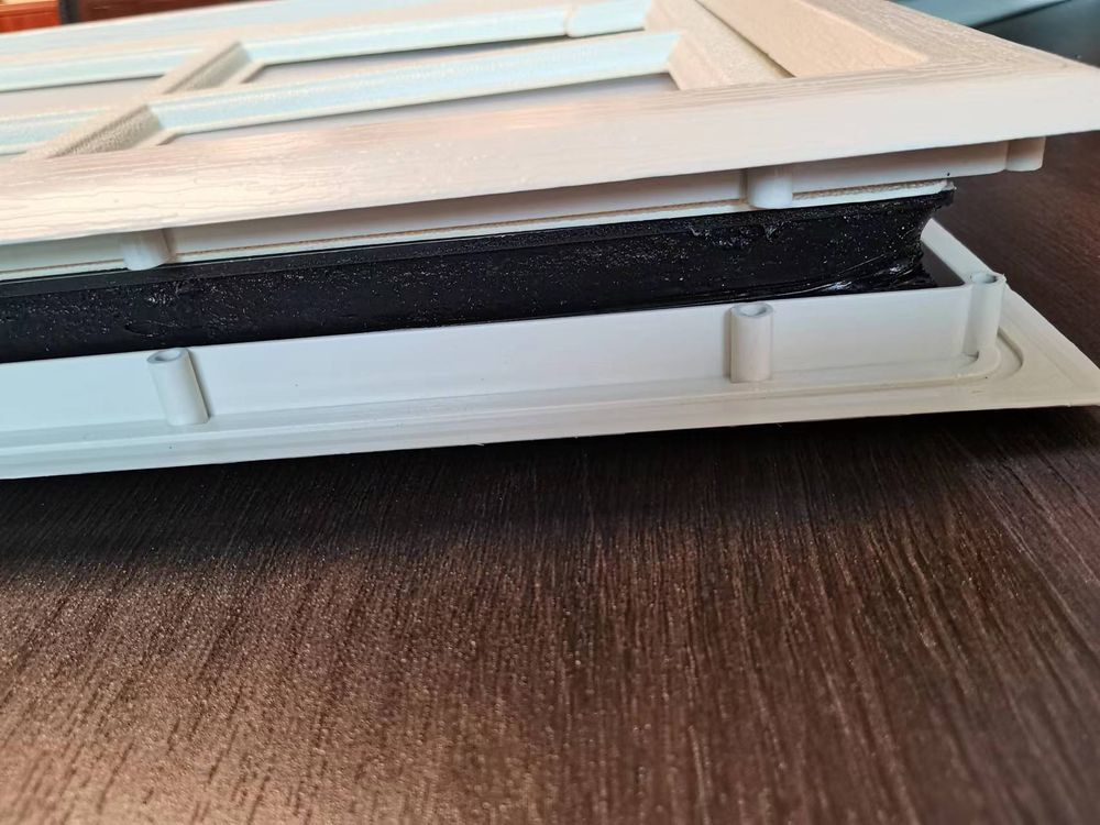 Sectional garage door panel cross-section showing polyurethane insulation core